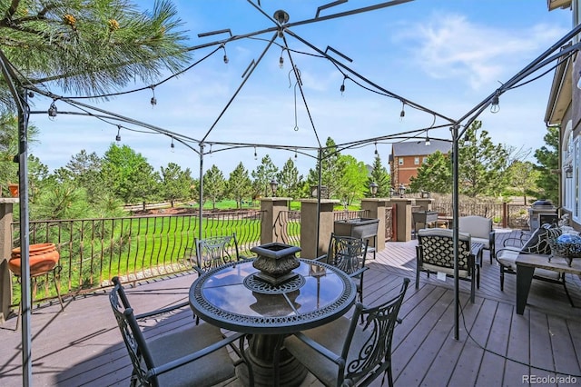 8518 High Rdg, Castle Pines, CO 80108 - deck featuring a lawn and outdoor dining space