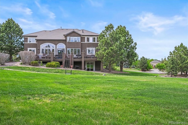 8518 High Rdg, Castle Pines, CO 80108 - back of property with a deck, stucco siding, and a yard