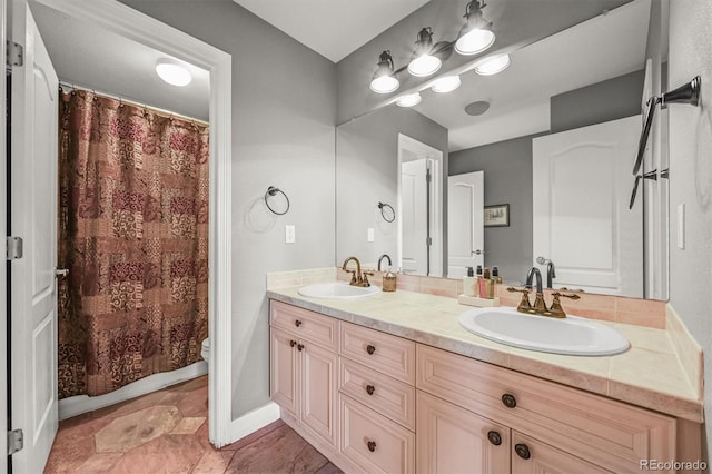 8518 High Rdg, Castle Pines, CO 80108 - bathroom with double vanity and toilet