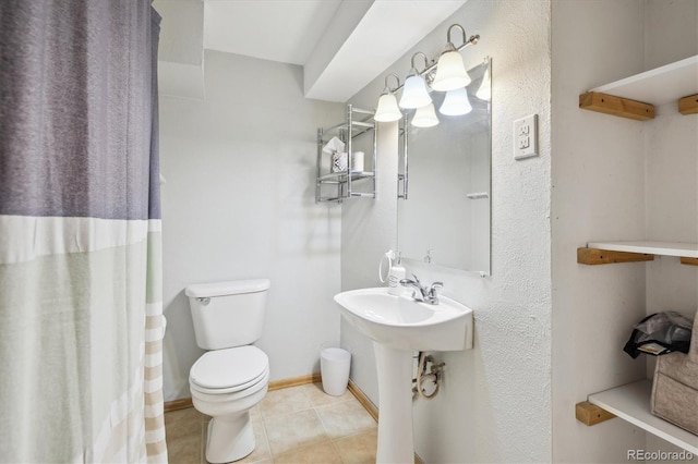 5007 S Richfield Cir, Aurora, CO 80015 - bathroom featuring toilet, tile patterned flooring, and baseboards