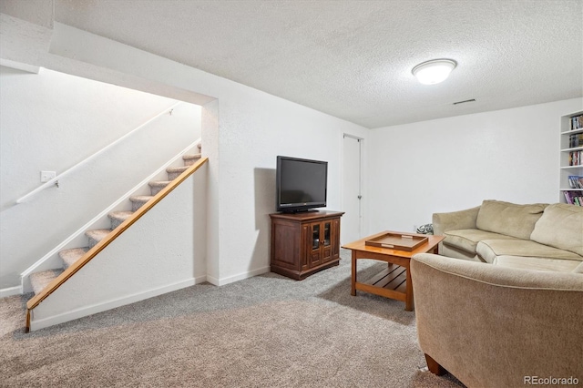 5007 S Richfield Cir, Aurora, CO 80015 - carpeted living area with stairway, a textured ceiling, and baseboards