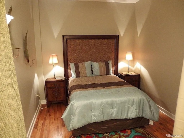 1441 Central St Unit 211, Denver, CO 80211 - bedroom featuring wood finished floors and baseboards