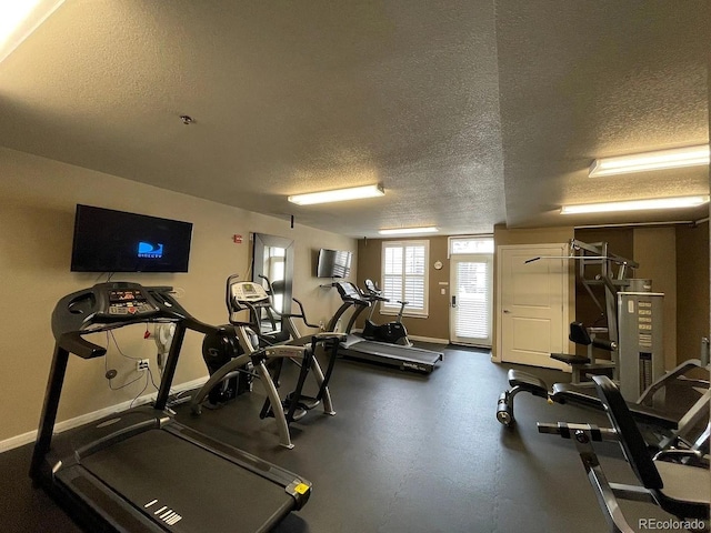 1441 Central St Unit 211, Denver, CO 80211 - workout area with a textured ceiling and baseboards