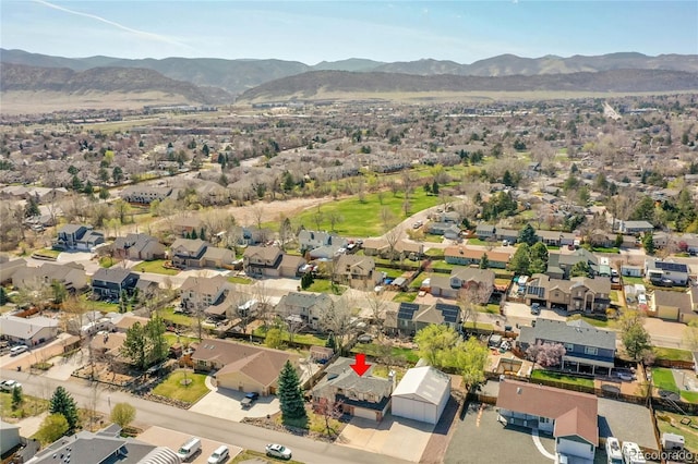drone / aerial view with a residential view and a mountain view