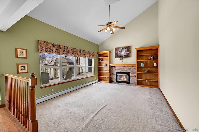 unfurnished living room with high vaulted ceiling, carpet flooring, baseboard heating, and ceiling fan