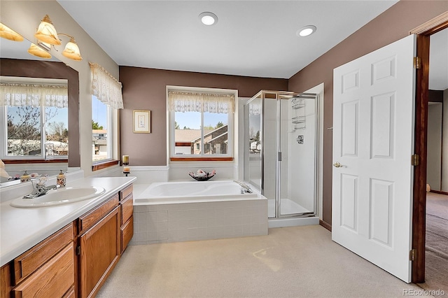 bathroom featuring a shower stall, vanity, recessed lighting, and a garden tub