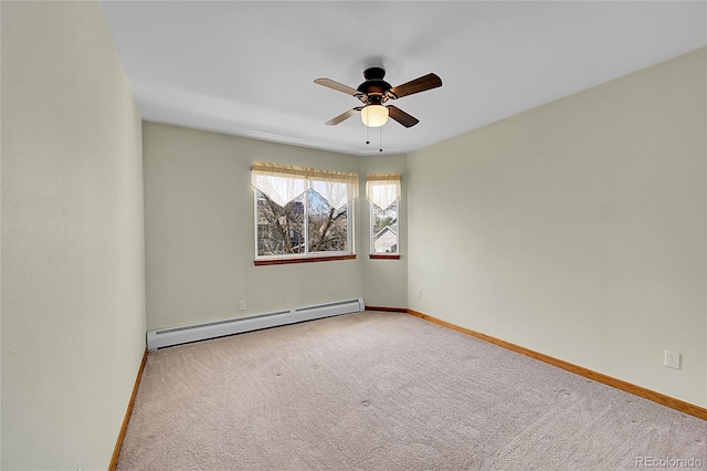 carpeted empty room with a baseboard radiator, ceiling fan, and baseboards