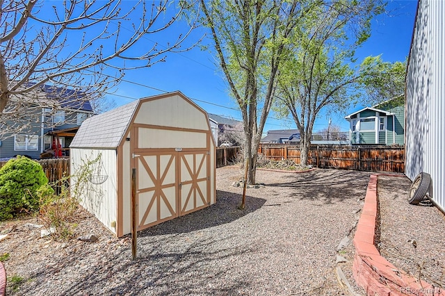 view of shed with a fenced backyard