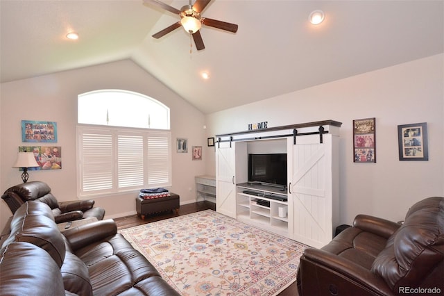 10511 Desert Bloom Way, Colorado Springs, CO 80925 - living area featuring ceiling fan, vaulted ceiling, a barn door, wood finished floors, and recessed lighting