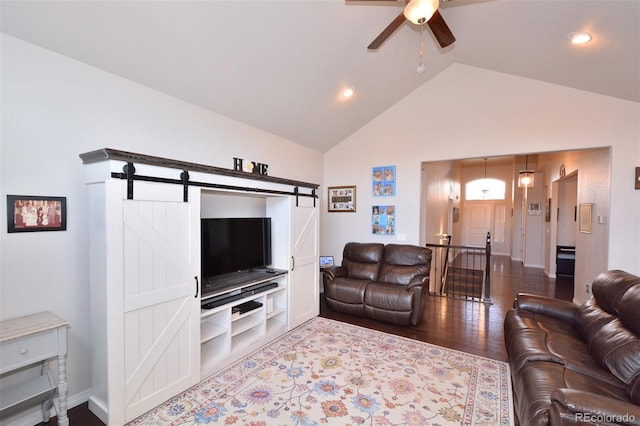 10511 Desert Bloom Way, Colorado Springs, CO 80925 - living room with ceiling fan, a barn door, wood finished floors, recessed lighting, and high vaulted ceiling