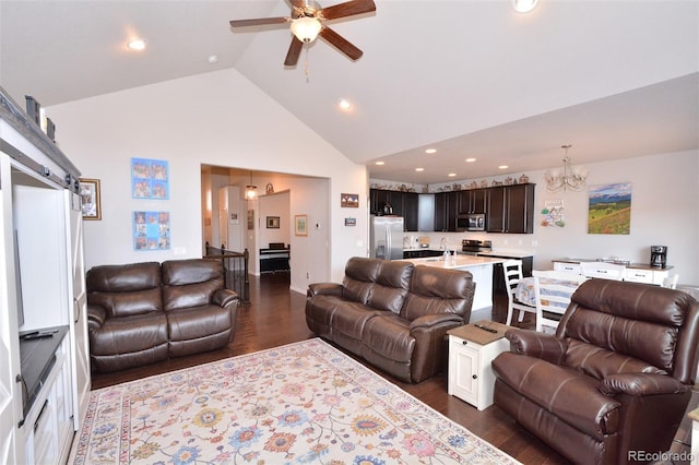 10511 Desert Bloom Way, Colorado Springs, CO 80925 - living room with a chandelier, dark wood-style floors, a ceiling fan, high vaulted ceiling, and recessed lighting