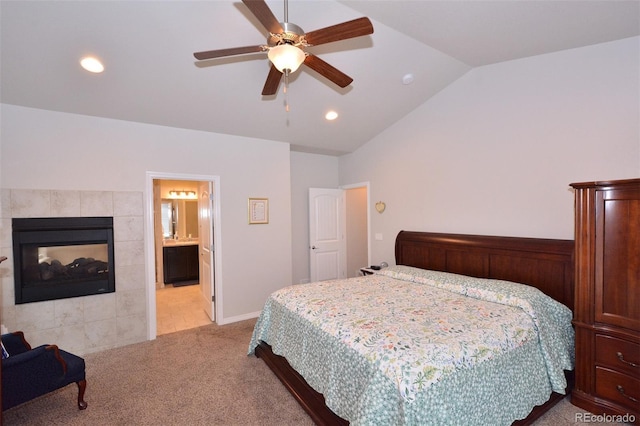 10511 Desert Bloom Way, Colorado Springs, CO 80925 - bedroom featuring light carpet, vaulted ceiling, a fireplace, recessed lighting, and a ceiling fan