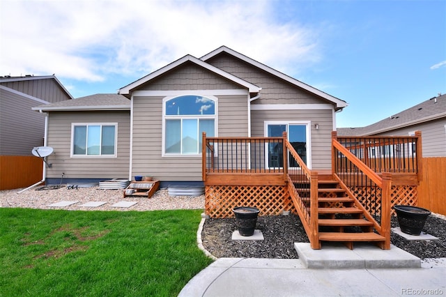 10511 Desert Bloom Way, Colorado Springs, CO 80925 - rear view of house featuring a wooden deck and stairs