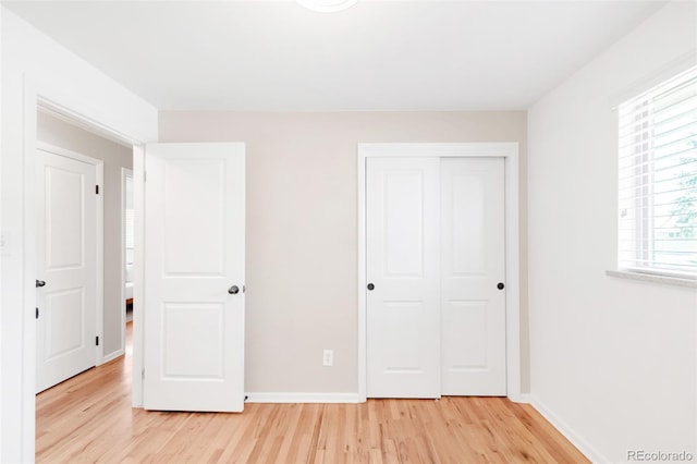 2756 E Euclid Ave, Centennial, CO 80121 - unfurnished bedroom featuring light wood finished floors, a closet, and baseboards