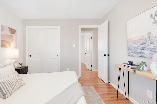 2756 E Euclid Ave, Centennial, CO 80121 - bedroom featuring light wood-type flooring, a closet, and baseboards