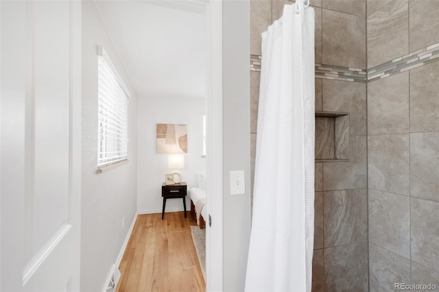 2756 E Euclid Ave, Centennial, CO 80121 - full bathroom with wood finished floors, tiled shower, and connected bathroom