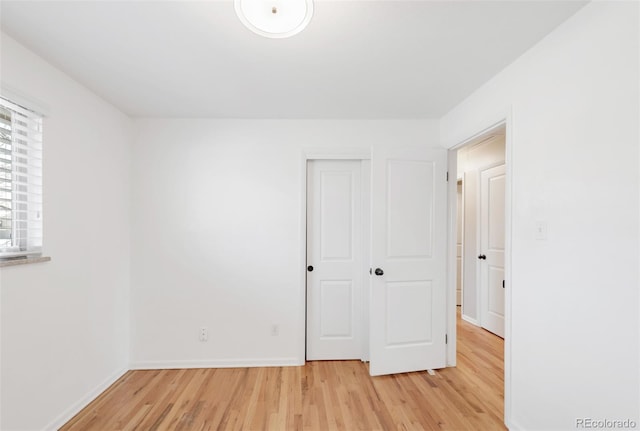 2756 E Euclid Ave, Centennial, CO 80121 - unfurnished bedroom with light wood-style floors, baseboards, and a closet