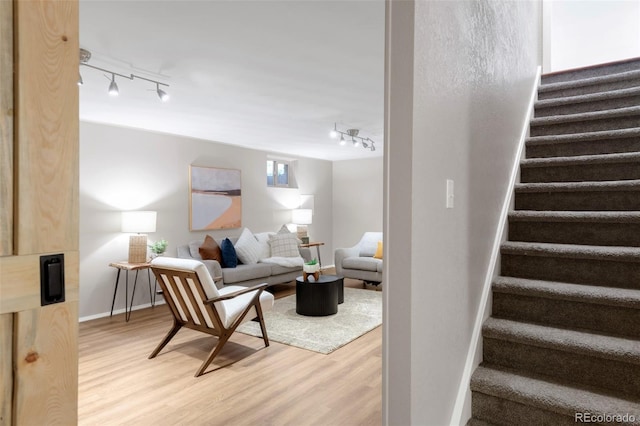 2756 E Euclid Ave, Centennial, CO 80121 - living area featuring track lighting, stairway, and light wood-style flooring