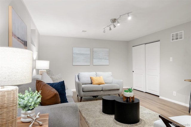 2756 E Euclid Ave, Centennial, CO 80121 - living area featuring light wood-type flooring and baseboards