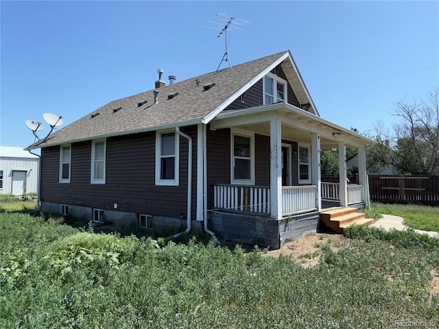 227 Milton St, Briggsdale, CO 80611 - rear view of property with covered porch and roof with shingles