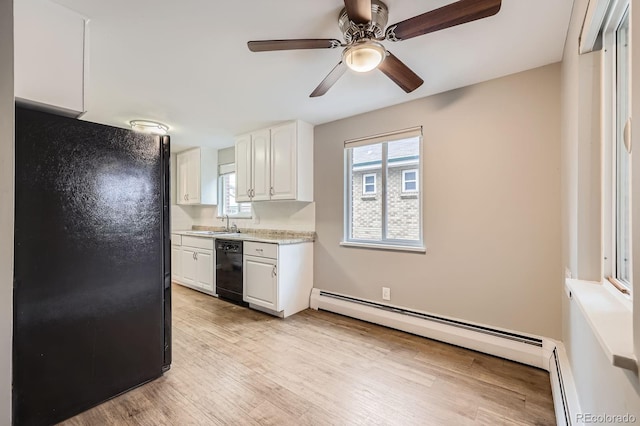 1824 S Columbine St, Denver, CO 80210 - kitchen featuring black appliances, light countertops, white cabinets, a baseboard heating unit, and a ceiling fan