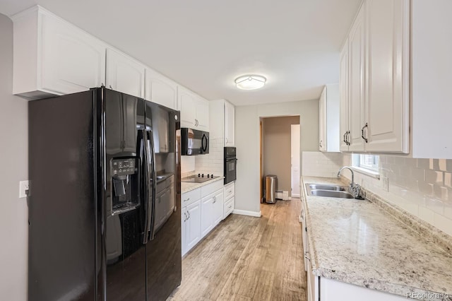1824 S Columbine St, Denver, CO 80210 - kitchen with black appliances, a sink, decorative backsplash, light wood-style flooring, and white cabinets