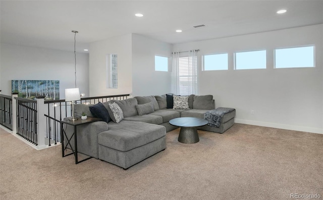 living room featuring carpet floors, recessed lighting, visible vents, and baseboards