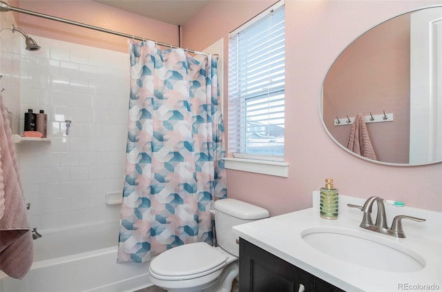 bathroom featuring shower / bath combo with shower curtain, vanity, and toilet