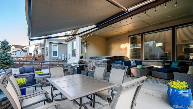 view of patio / terrace featuring outdoor dining area, a grill, an outdoor kitchen, and an outdoor hangout area