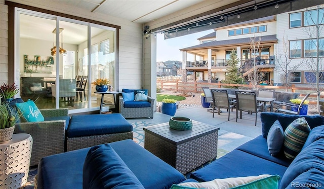 view of patio featuring outdoor dining area and an outdoor hangout area