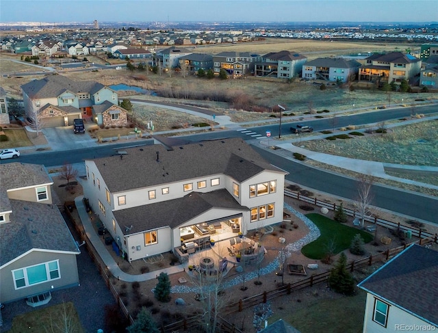 birds eye view of property with a residential view