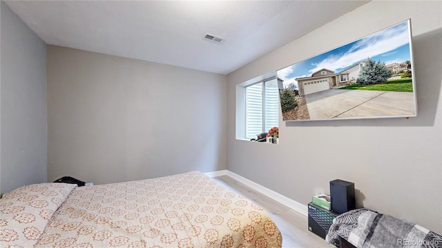 bedroom with wood-type flooring