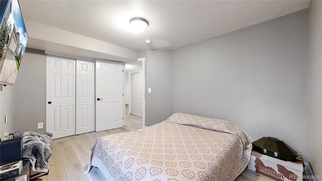 bedroom with a closet and light wood-type flooring