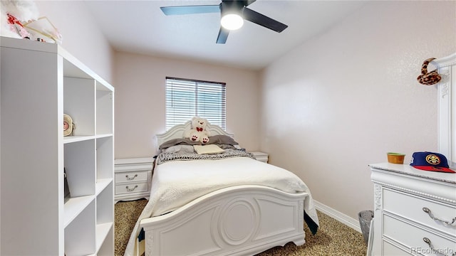 bedroom featuring ceiling fan and carpet floors