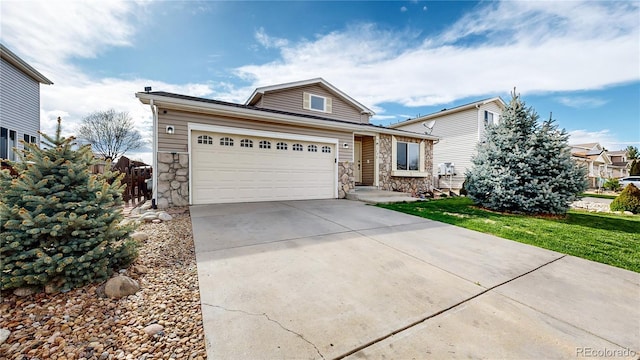 view of front of house with a garage and a front yard