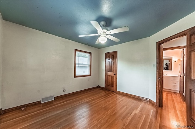 1325 N Foote Ave, Colorado Springs, CO 80909 - unfurnished bedroom with light wood-style flooring, baseboards, and ceiling fan