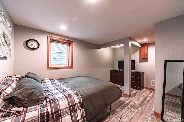 1325 N Foote Ave, Colorado Springs, CO 80909 - bedroom featuring light wood-style flooring, baseboards, a textured wall, and recessed lighting