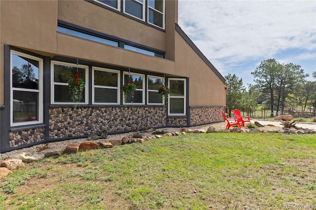 1819 Nova Rd, Pine, CO 80470 - view of side of home featuring stone siding and a yard