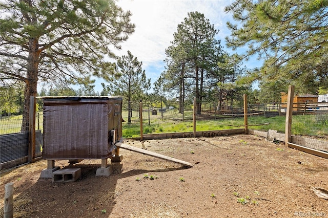 1819 Nova Rd, Pine, CO 80470 - view of yard featuring exterior structure, an outdoor structure, and a vegetable garden