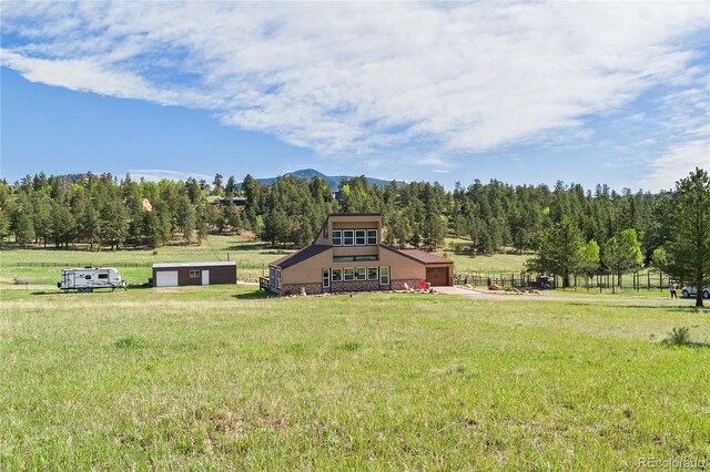 1819 Nova Rd, Pine, CO 80470 - view of grassy yard featuring a garage