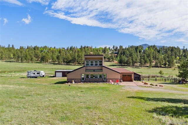 1819 Nova Rd, Pine, CO 80470 - view of front of house featuring a garage, driveway, and stucco siding