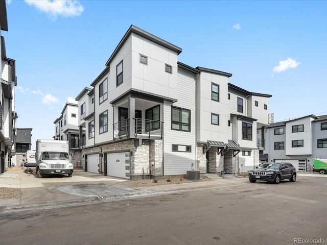 view of front of house featuring cooling unit and a residential view