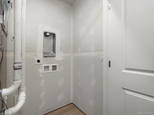 laundry area with laundry area, light wood-style flooring, hookup for a washing machine, and electric dryer hookup