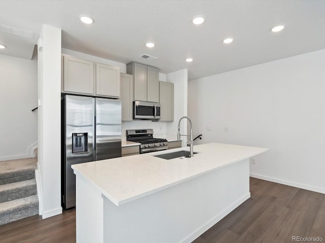 2036 S Holly St Unit 4, Denver, CO 80222 - kitchen with a sink, an island with sink, stainless steel appliances, dark wood-style flooring, and gray cabinetry