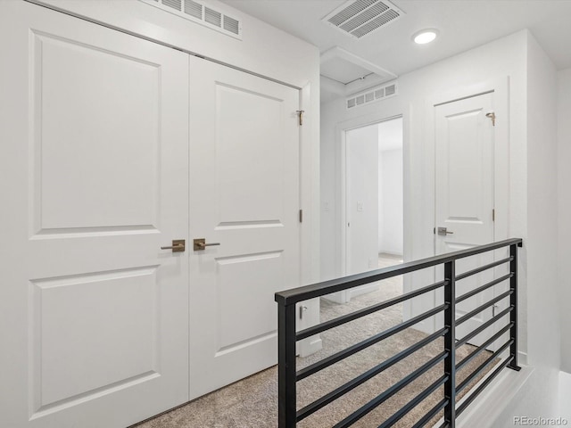 2036 S Holly St Unit 4, Denver, CO 80222 - corridor featuring an upstairs landing and visible vents