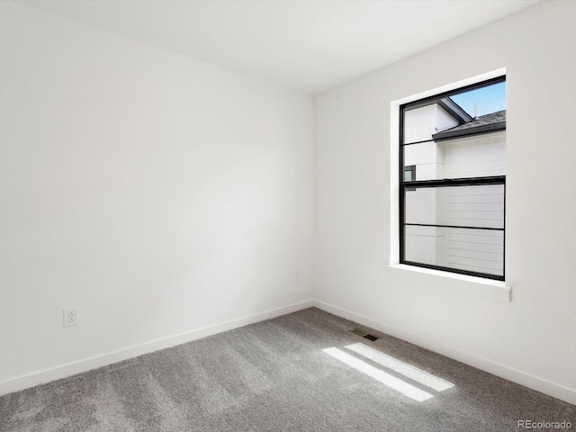 2036 S Holly St Unit 4, Denver, CO 80222 - carpeted empty room featuring baseboards and visible vents