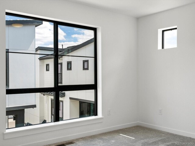 2036 S Holly St Unit 4, Denver, CO 80222 - unfurnished room featuring carpet floors and baseboards