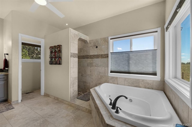 bathroom with a whirlpool tub, a walk in shower, baseboards, and a ceiling fan