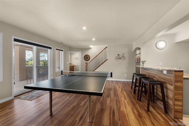 playroom with wood finished floors, baseboards, a dry bar, and recessed lighting