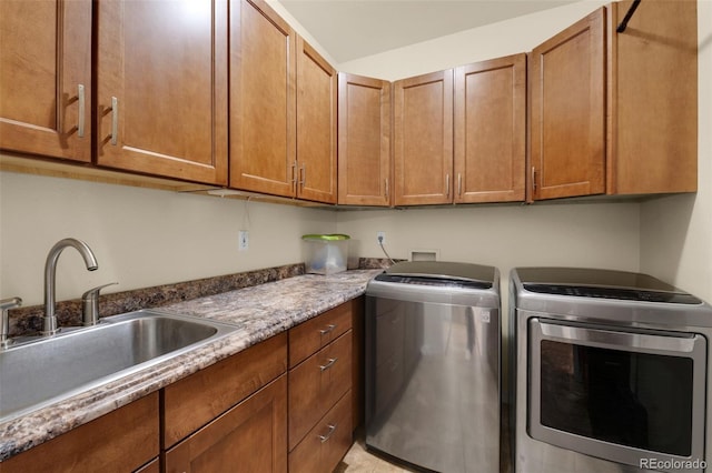 laundry room featuring washer and clothes dryer and cabinet space